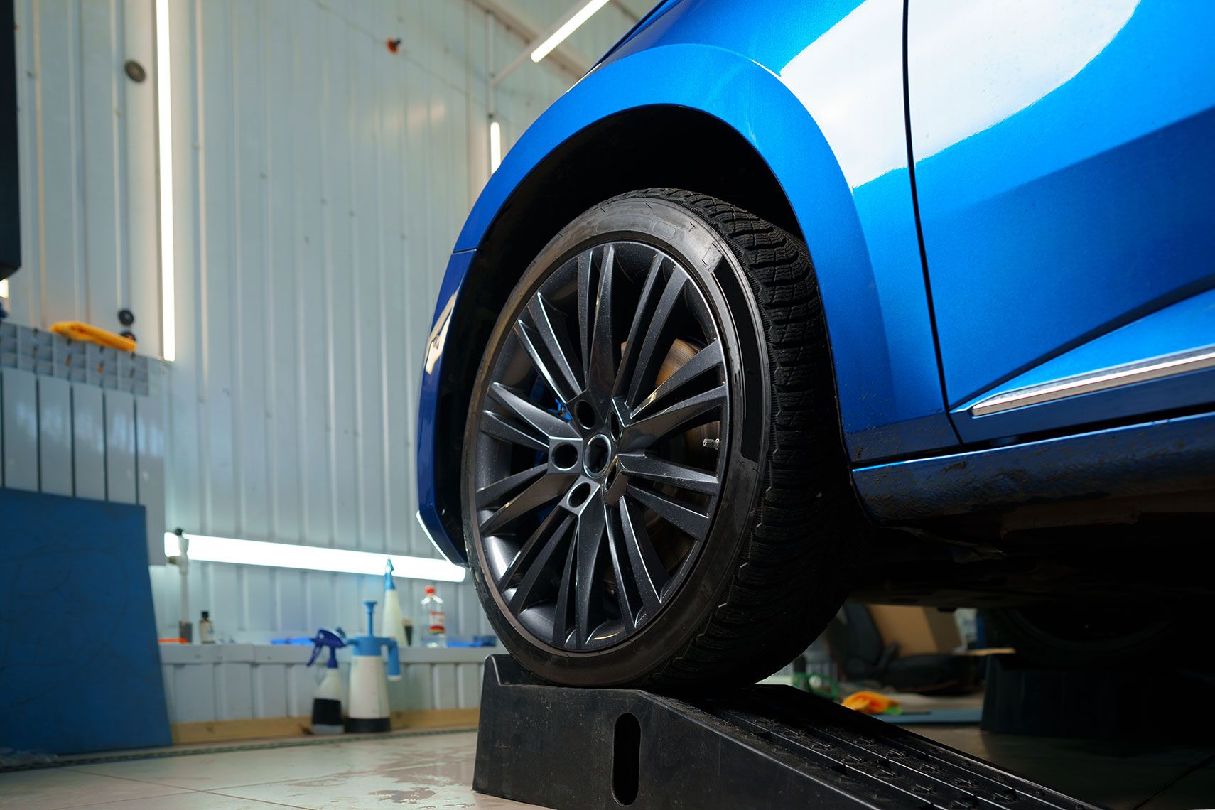 front-wheel-of-modern-blue-sport-car