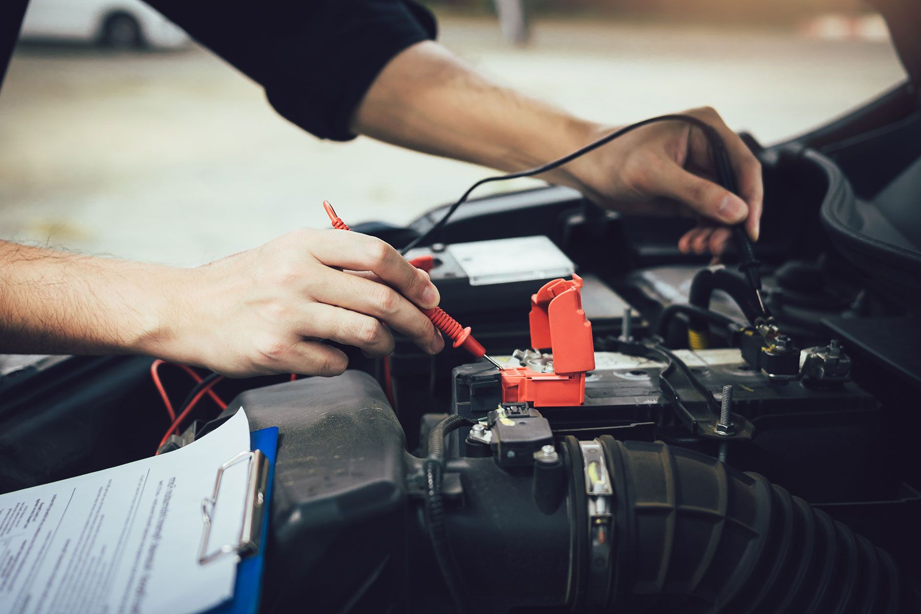 car-mechanic-is-using-the-car-battery