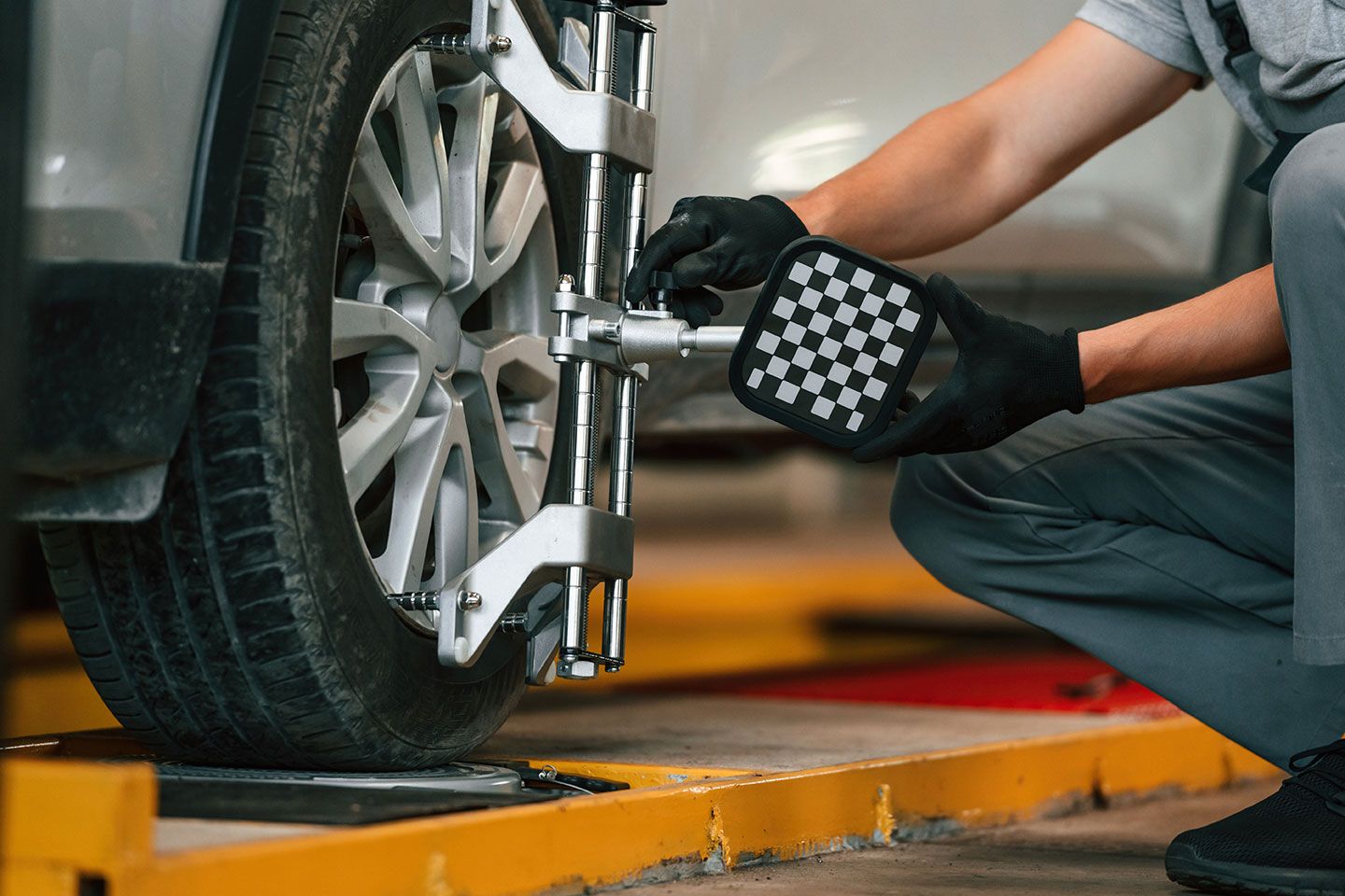 adjusting-the-tire-man-is-works-in-the-automobile