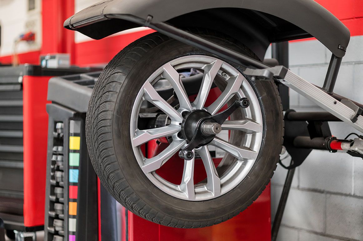 wheel-on-balancer-in-workshop