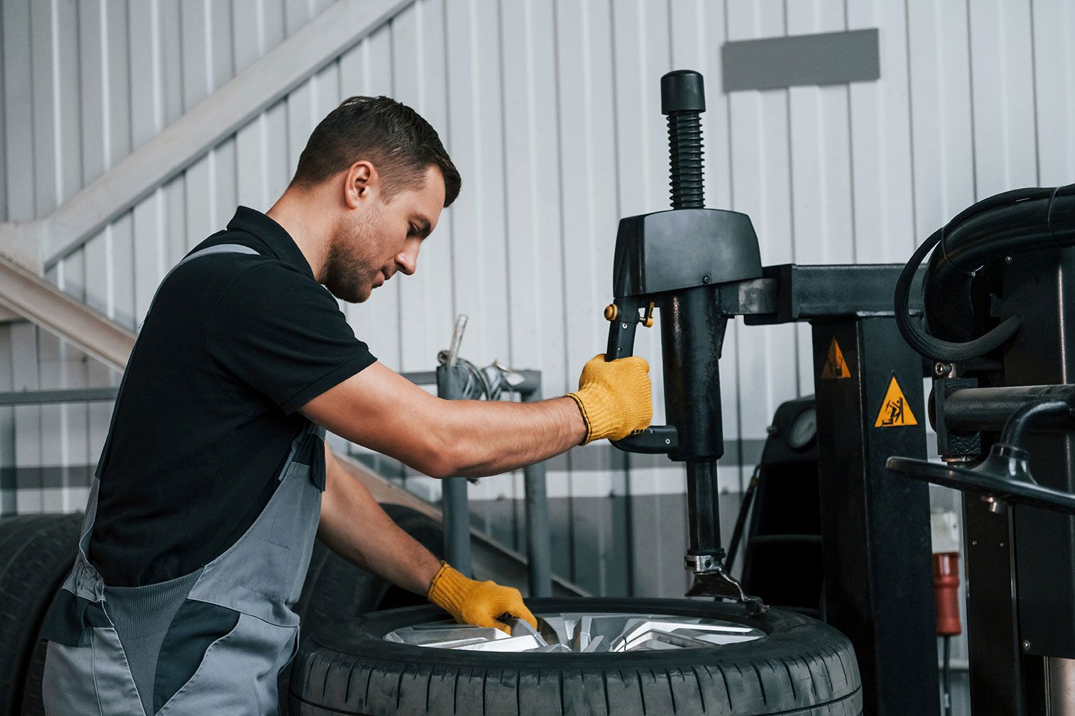 strong-hands-man-in-uniform-is-working-in-the-aut