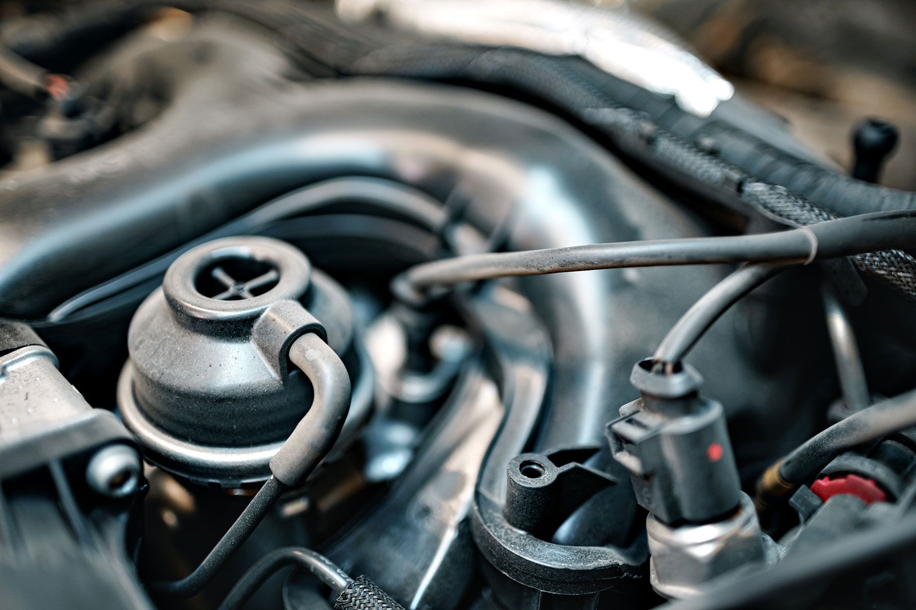 dirty-engine-under-the-hood-of-a-car-hoses