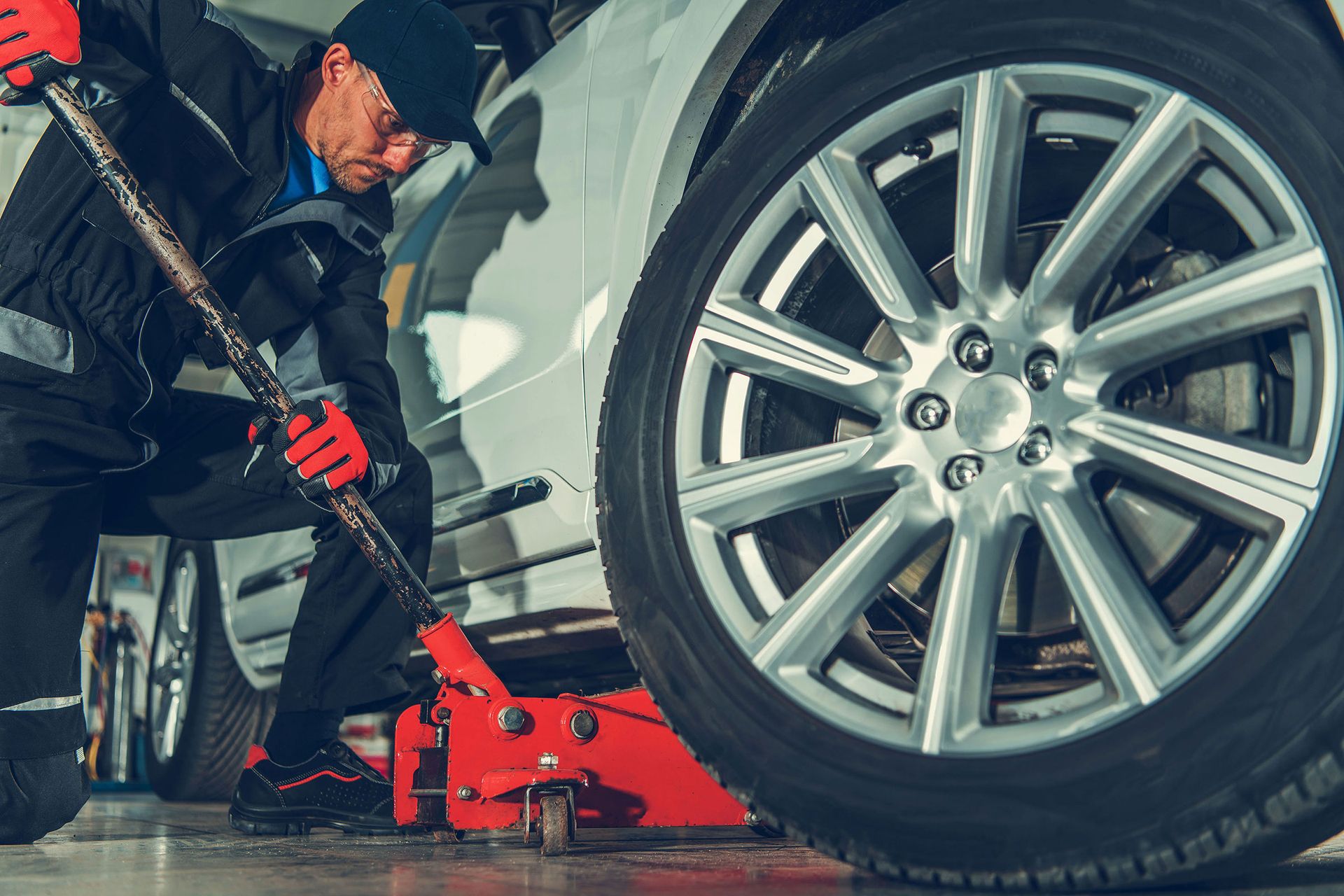 mechanic-with-floor-jack-lift