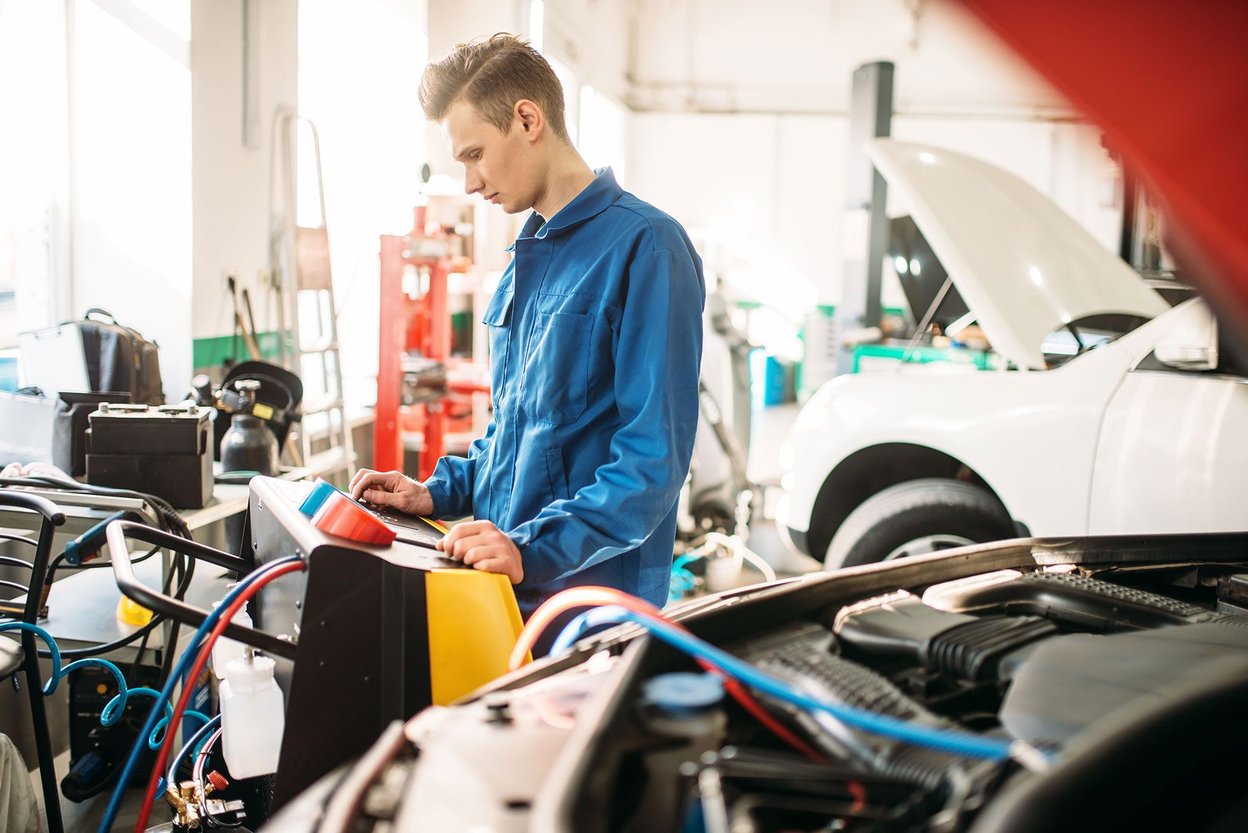 mechanic-checks-air-conditioning-system-in-car