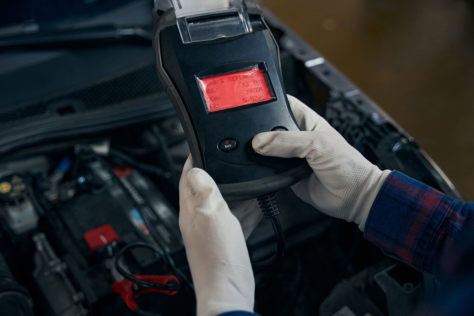 close-up-photo-of-man-holding-voltmeter