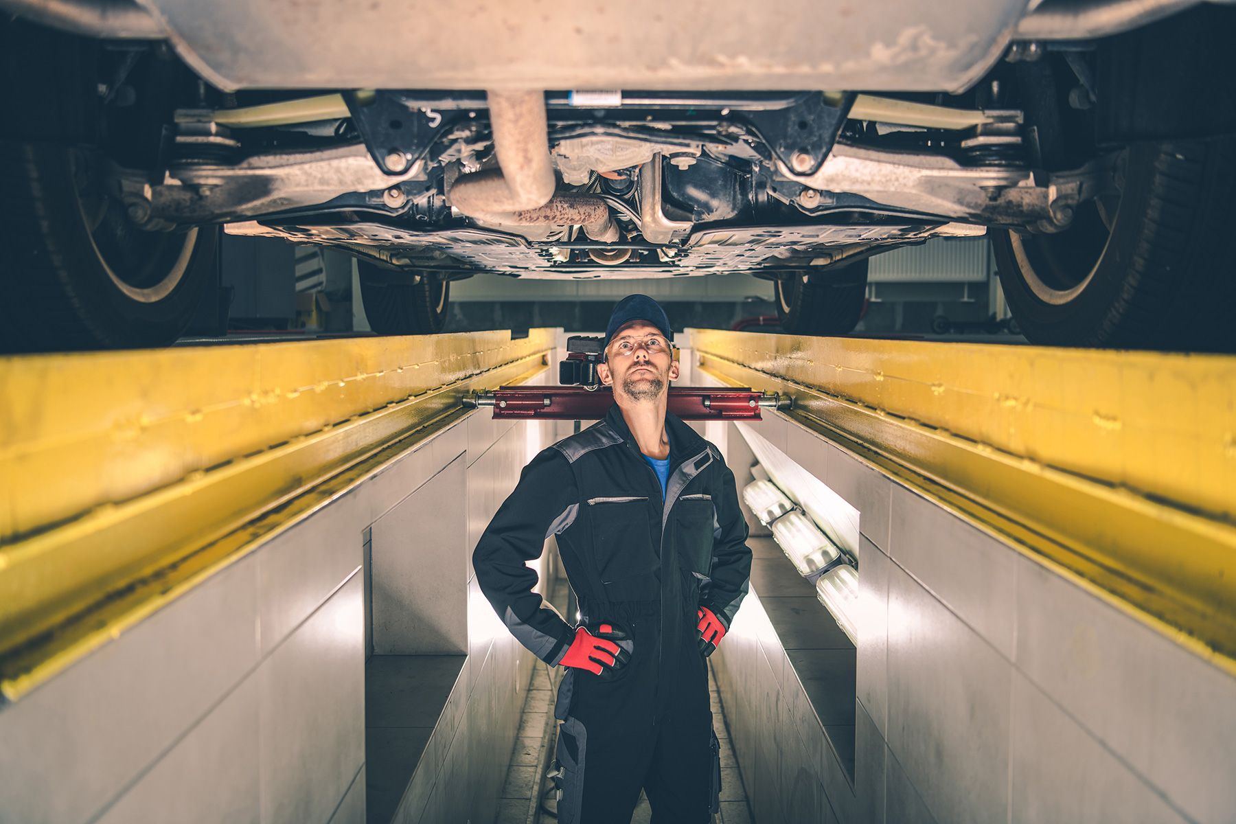 automotive-mechanic-under-the-car-2022
