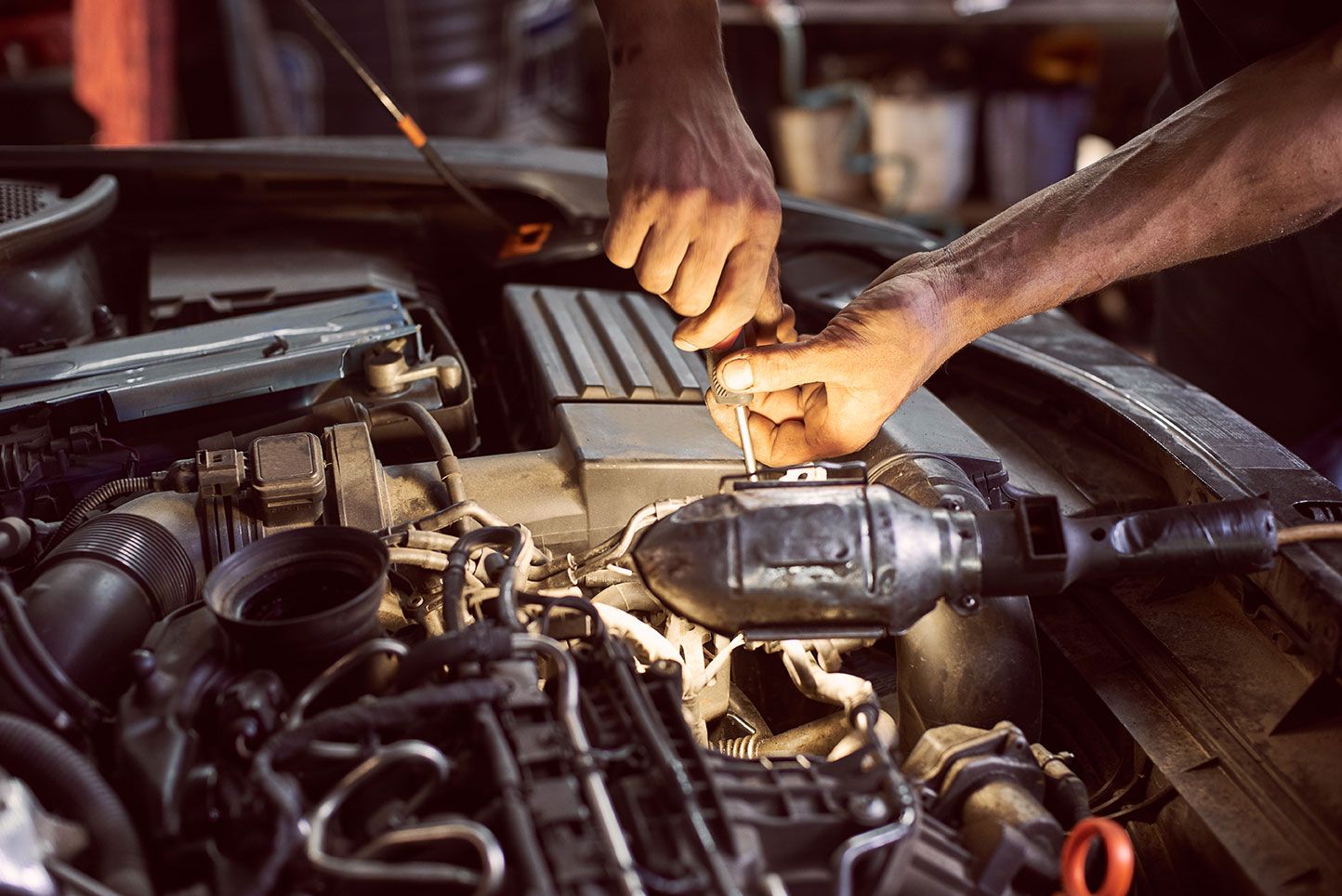 repairing-diesel-engine-with-screwdriver-and-flash